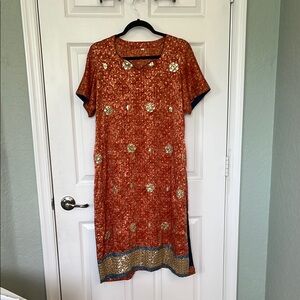 Elegant Orange Dress with Gold Accents